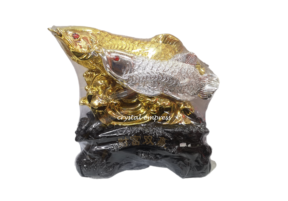 Gold and Silver Arowana with Child in Coin Scales